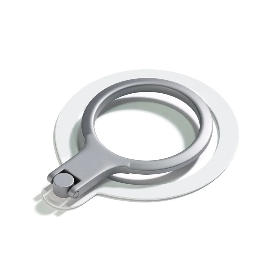 白い円形の土台の上に、シルバーメタリックのスマホリングが置かれている