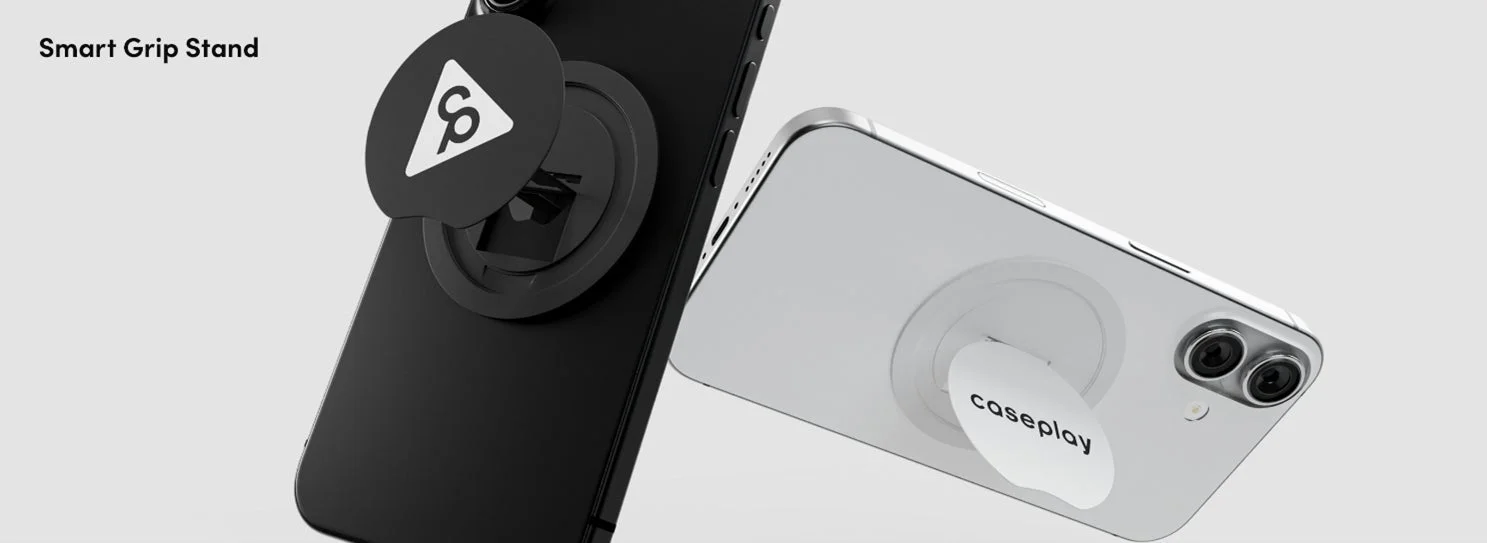 黒と白のスマートフォンに、それぞれ「Smart Grip Stand」という名称のグリップスタンドが装着されている様子を捉えた画像です。