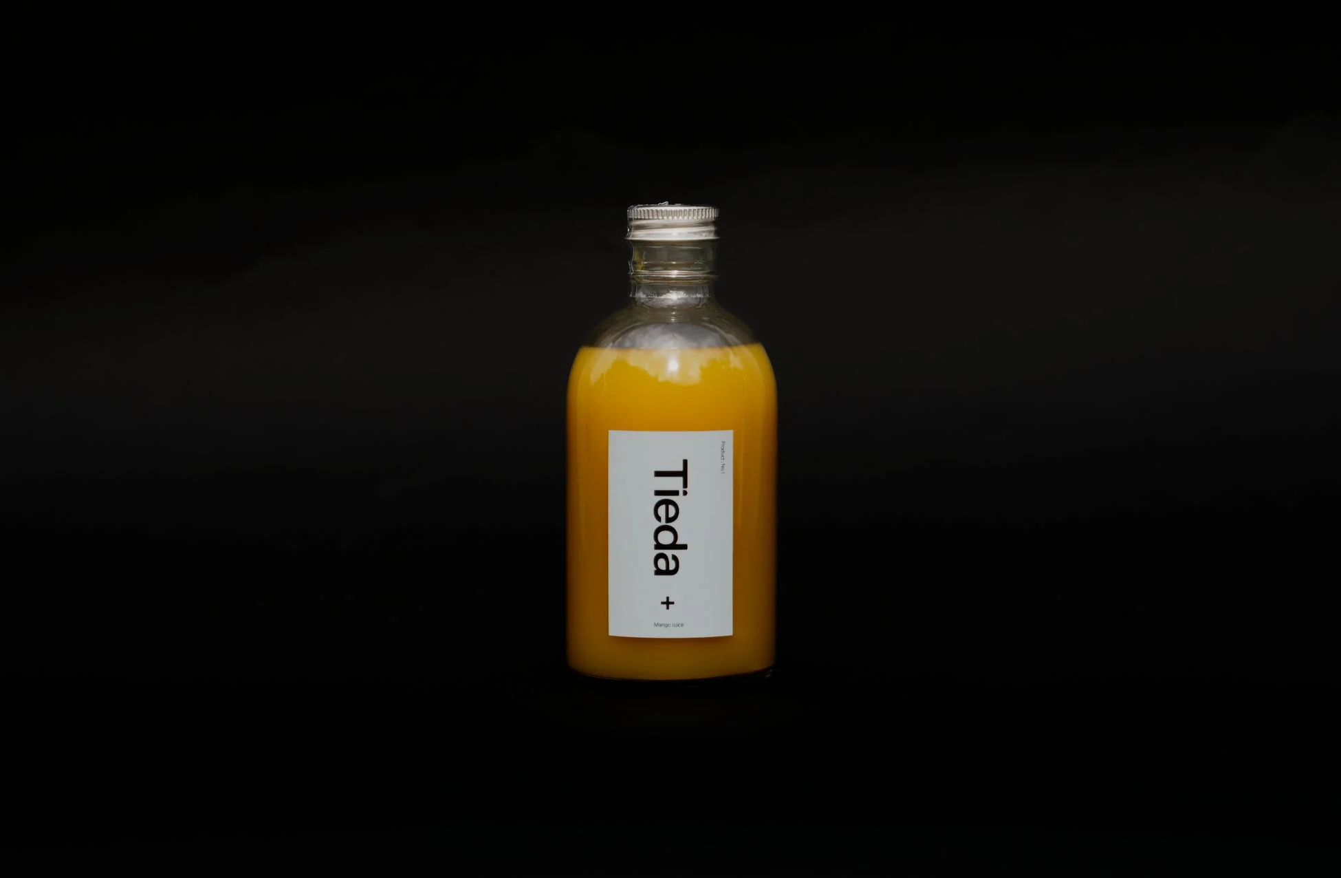 Tieda+オリジナルマンゴージュースのボトル